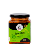 Jar of lemon pickle with green label and black lid on a white background