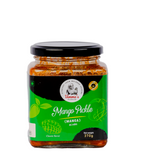 Jar of mango pickle with a green label on a white background