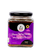 Jar of prawn chutney powder with a purple label on a white background